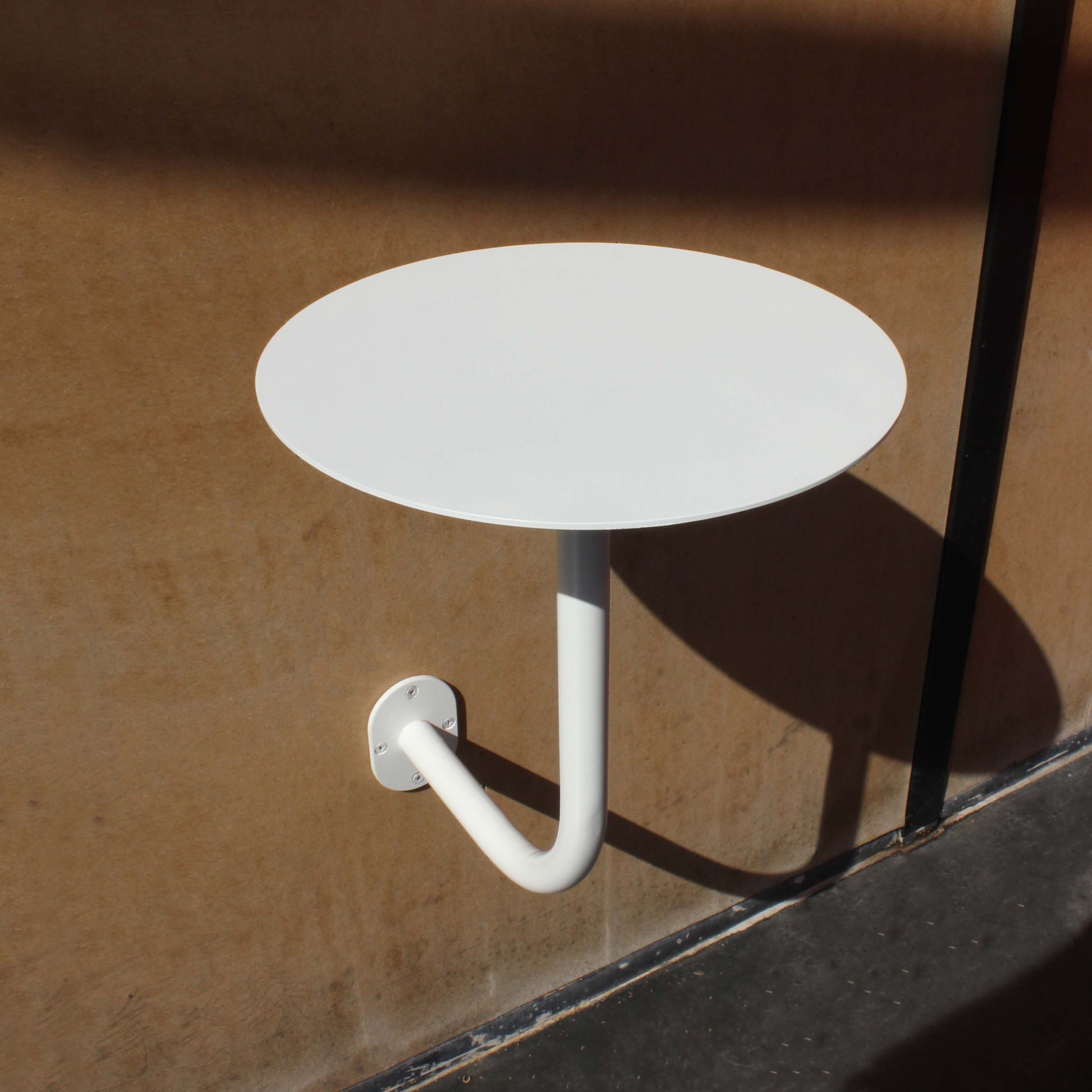 The table provides enough space for drinks, laptops, or décor. Available in wall mounted round table and square table styles.
