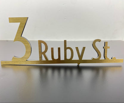 The Wayfinding numbers and name sign combines style and practicality. Crafted from durable steel, it offers long-lasting performance while maintaining an elegant aesthetic. The customizable font and height allow you to personalize the sign to fit your space perfectly. Its adhesive backing makes installation effortless, and its weather-resistant properties ensure that it performs well in both indoor and outdoor settings. Whether for an office, hotel, or home, this sign provides clear and stylish room identif