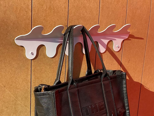 The Wiggle Wall Hanger stands out with its unique and stylish wavy design, making it the perfect decorative addition to any space. Crafted from high-quality metal, it combines function with an artistic flair. Ideal for homes, offices, and hotels, this wall-mounted metal hanger organizes your jackets, bags, or accessories while enhancing the overall aesthetic of your room.

