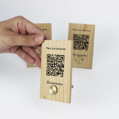 This wooden QR code menu stand combines style and practicality for modern businesses. Made from durable natural wood, it’s perfect for restaurants, cafes, and hotels. The sleek design supports QR codes for digital menus, making it both hygienic and cost-effective. Add your logo or brand name to make it a personalized tabletop wooden menu display that complements any decor beautifully.

