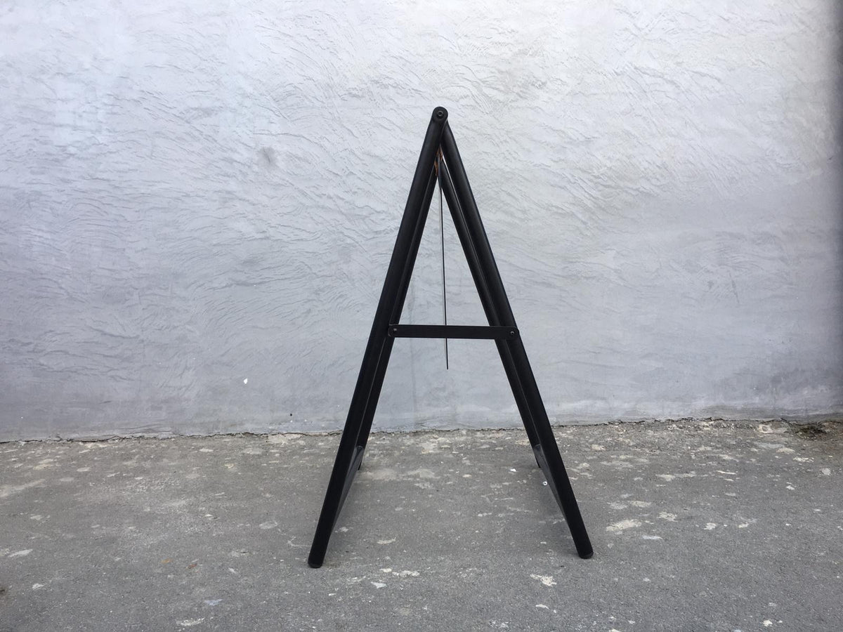 Side view of the unprinted black A-frame sign showing the folding frame and support bar