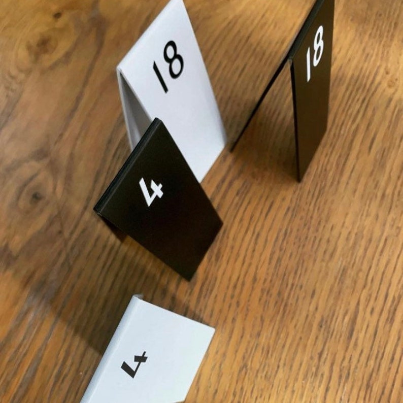 Compact stackable metal table numbers for easy storage