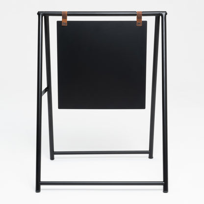 Unprinted black A-frame sidewalk sign, front view with leather panel straps