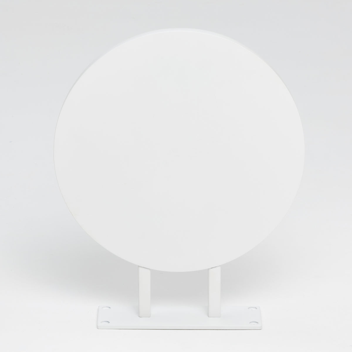 Front view of blank white round blade sign with twin supports
