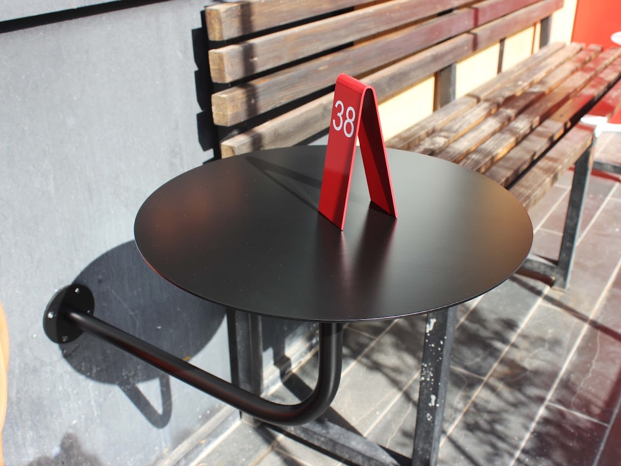 "Custom-made double-sided table numbers, personalized with logo printing and QR code options. Ideal for small businesses, cafes, and boutique shops."

