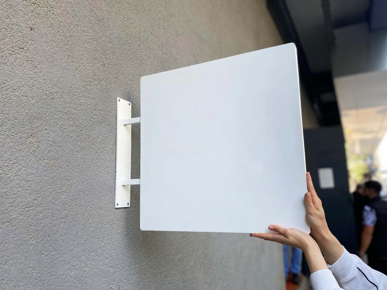 Heavy-duty double-sided square blade sign made of weather-resistant aluminum, featuring thick edges and vibrant prints, making it a perfect choice for businesses looking to attract attention year-round.
